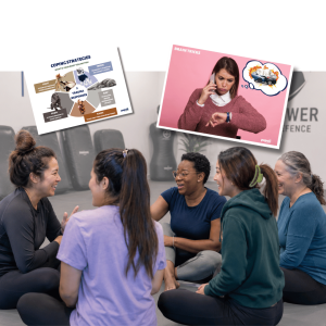 Two people in conversation with educational posters on wall showing brain tricks, honesty, family values, and healthy coping strategies