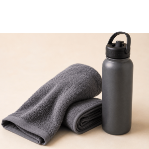 Blue towel and water bottle representing hydration and wellness essentials